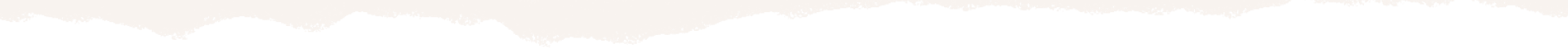 Silhouette of jagged mountain peaks at dusk.